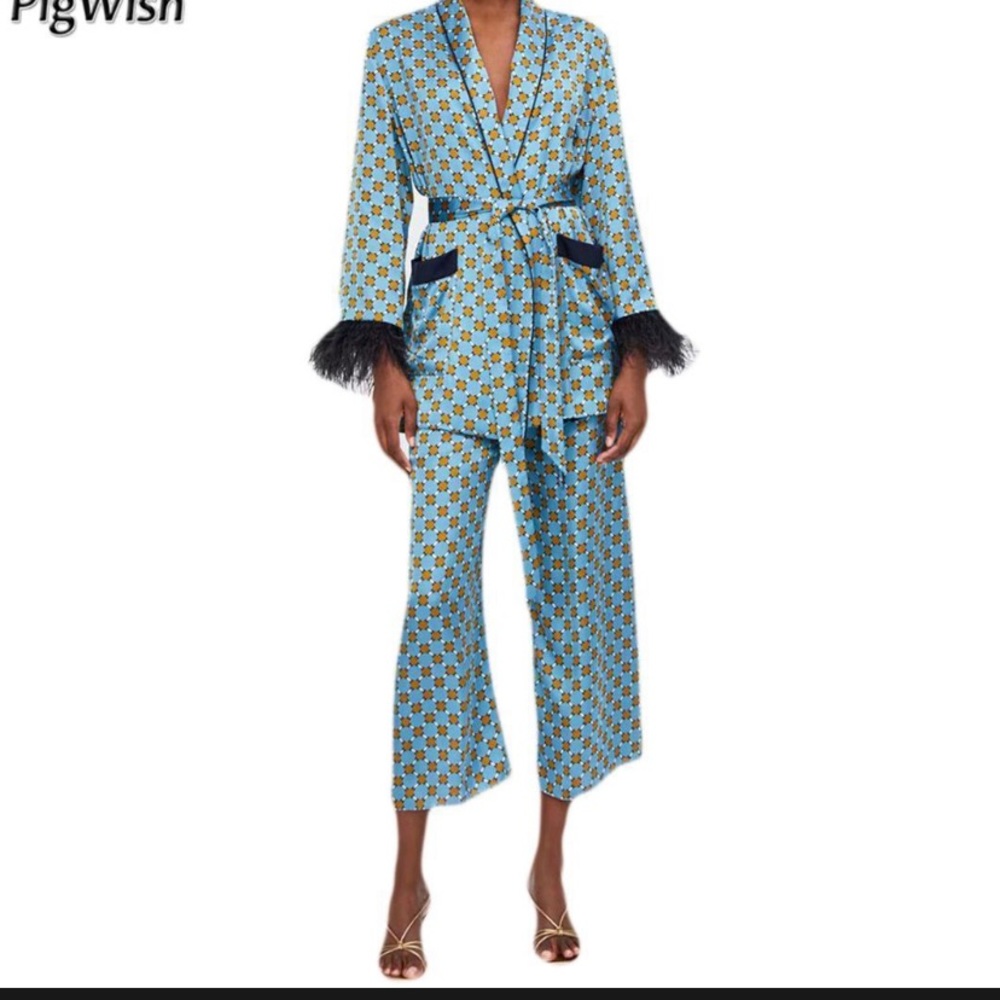 Blue blazer with black ostrich feather